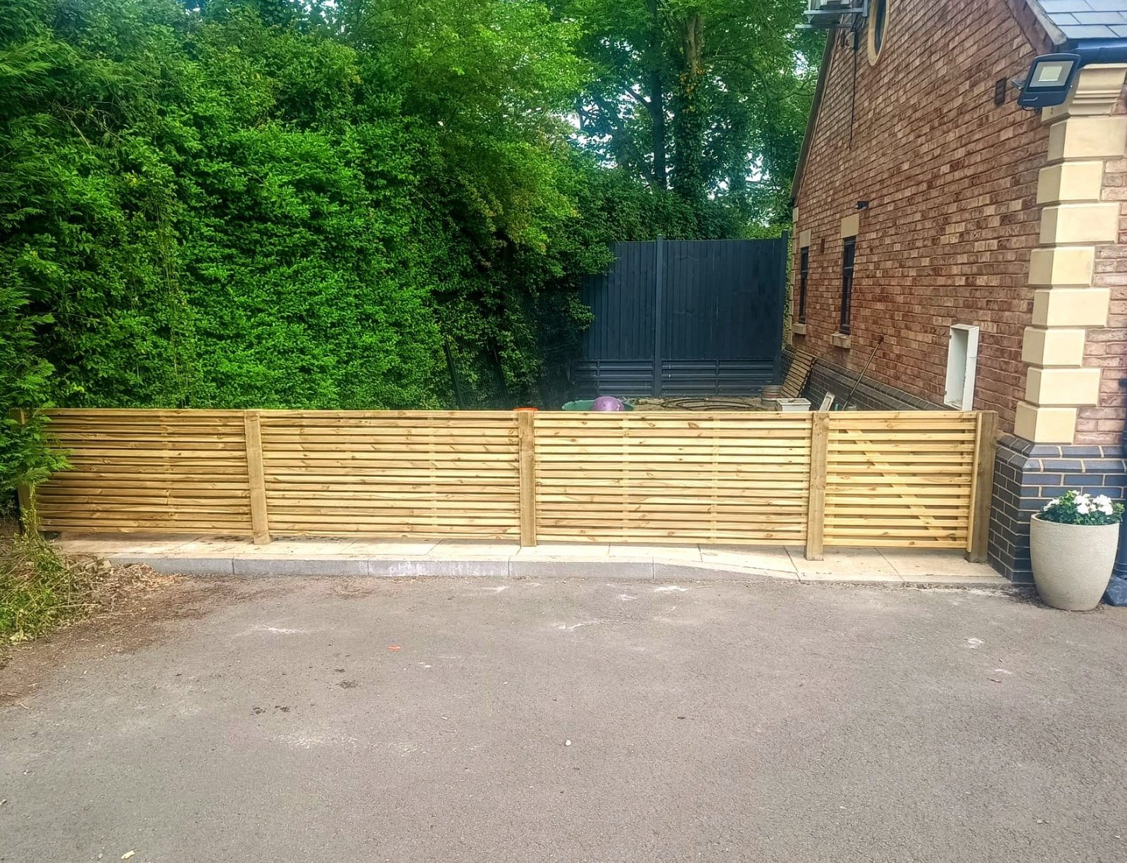 Low slatted wooden fence